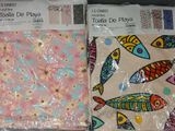 two sheets of fabric with fish designs on them
