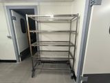a metal shelf that is in the middle of a room