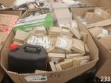many boxes of assorted items in a pile