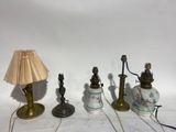 three lamps are sitting next to each other on a table