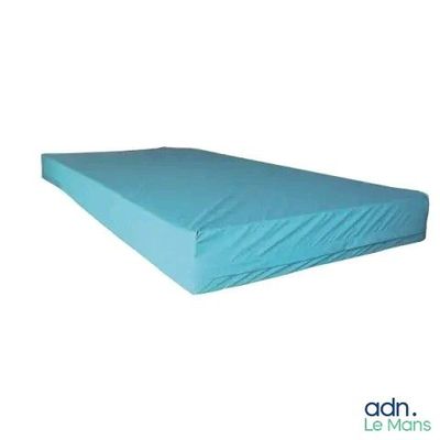 the mattress is made of foam and has a blue cover