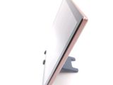 a tablet computer sitting on top of a stand
