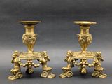 pair of antique brass candlesticks with cherenshes and cherenshes