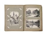 an old photo of a book opened to show pictures of a castle