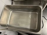 a metal pan that is sitting on top of a counter
