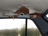 the interior of a car with a hole in the roof and a hole in the roof
