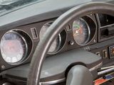 steering wheel of a car with gauges, gauges, and dash board