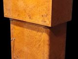 a small wooden cabinet with a drawer on top of it