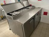 tiled floor in a commercial kitchen with stainless steel counter tops