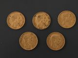 four gold sovereigns, one of which is a sovereign and the other of which is a sovereign