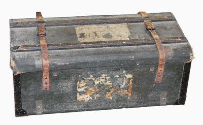an old trunk that is sitting on a white surface