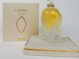 an image of a bottle of perfume sitting on top of a box