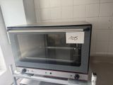 a toaster oven that is sitting on top of a shelf