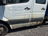 a white van that is parked on the side of the road