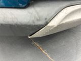 a close up of a car ' s bumper with rust on it