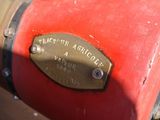 a close up of a red and gold fire hydrant