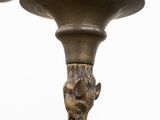 a close up view of a lamp with a lion head on it
