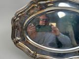 a man taking a picture of himself in a mirror