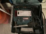 a tool in the case that is sitting on the floor