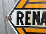 a sign that says rena on it in front of a building
