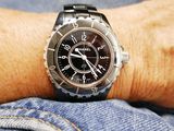 a watch on the wrist of a person wearing jeans