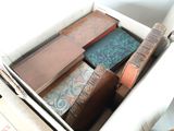 a box full of old books sitting on top of a table
