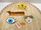 a tray with a variety of hair accessories on top of it