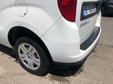 a white van that is parked on the side of the road