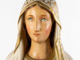 a statue of a woman with a veil on her head