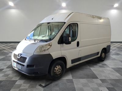 a white van that is parked in a room