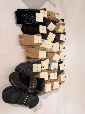 many pairs of socks hanging on the wall