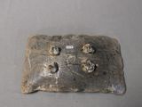 a small metal object that is sitting on a table