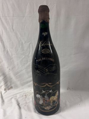 an image of a bottle of wine that is sitting on a table