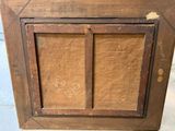 an old wooden picture frame with a picture of a dog on it