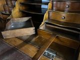 many wooden drawers that are stacked on top of each other