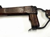 a gun that is sitting on a white surface