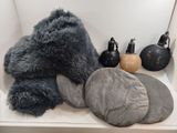 a teddy bear sitting on a shelf next to other items