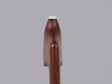 a close up of a wooden pen with a white tip