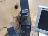 a desktop computer sitting next to a keyboard and a monitor