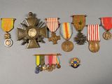 several medals and medals are displayed on a gray surface