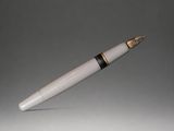 an image of a white pen with a gold tip