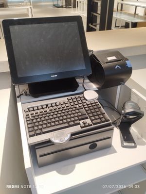 a laptop computer sitting on top of a white table
