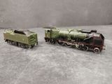 two toy trains that are sitting on a table