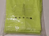 a bag of yellow towels on a white table