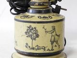 a yellow and black vase with a picture of a man on it