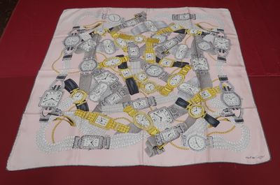 a square scarf with a bunch of watches on it