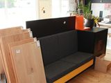 a couch that is in the middle of a room