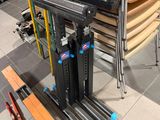 a stack of chairs and a table in a room