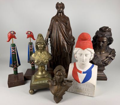 a lot of statues that are sitting on a table