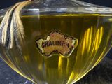 a glass jar with a label on it sitting on a table